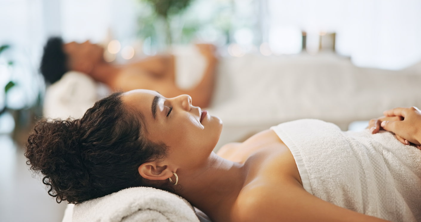 Couple, relax and bed at spa for wellness with massage session, anniversary date and hospitality service. People, rest and sleep with holistic peace, healing treatment and bonding together at resort